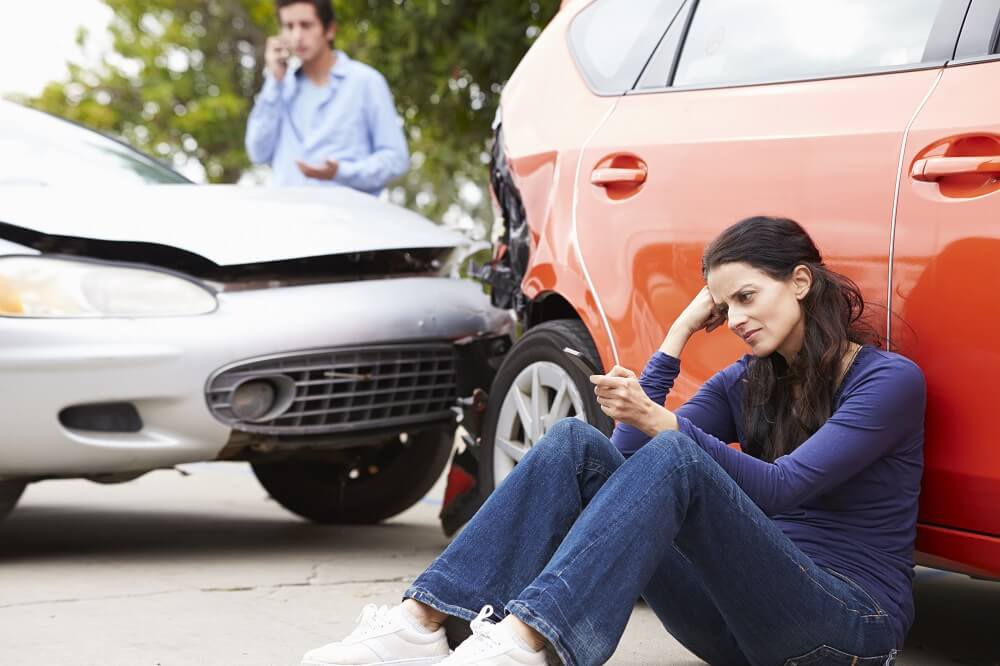 Woman worrying on the car accident.