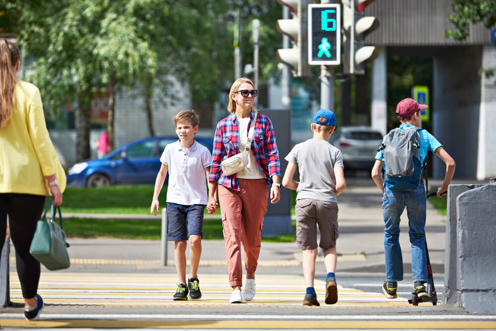 Pedestrians crossing on green light.