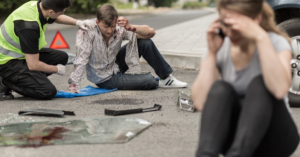 Injured man from car accident on road in Dallas, Georgia.