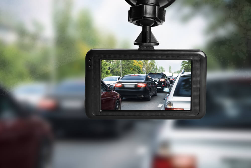 Modern dash cam mounted in a car.