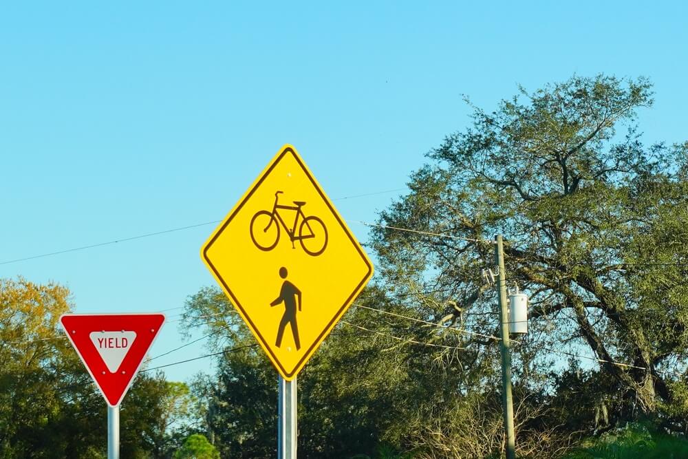 Bicycle and walking lane and yield sign