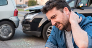 Driver involved in accident suffering neck pain after the collision.