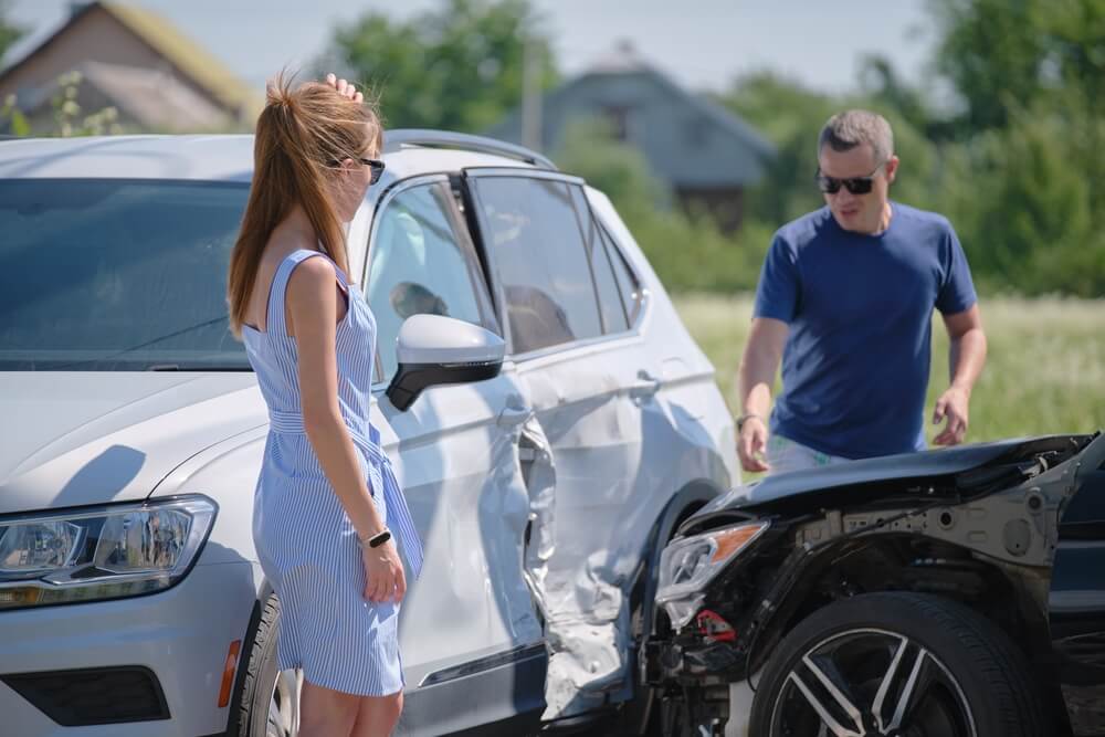 Female uber passenger feeling dizzy after car accident.