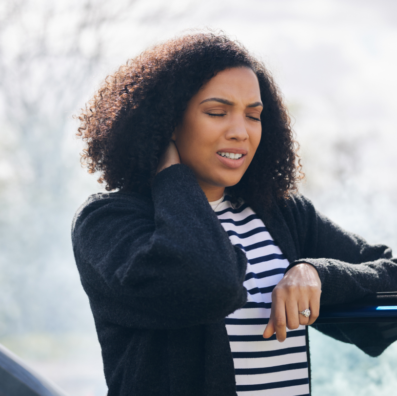 person holding their neck after an accident