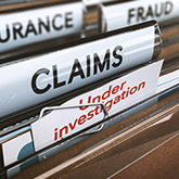 lawsuit claims in file folders