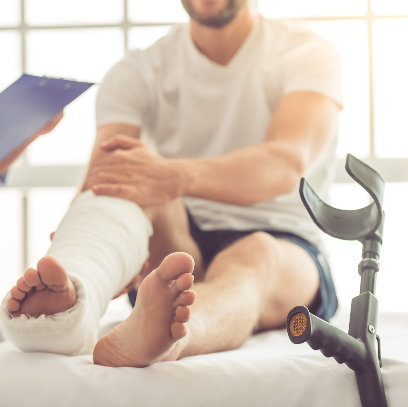 hurt man with a broken leg in a cast