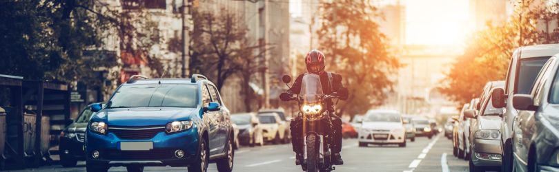 motorcycle rider in city traffic