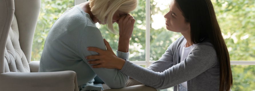 woman being consoled by her daughter after a wrongful death