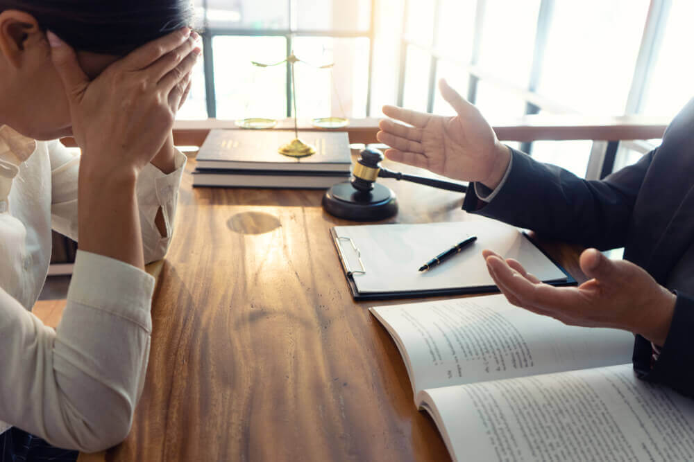 Worried client seeking legal advise from car accident lawyer.
