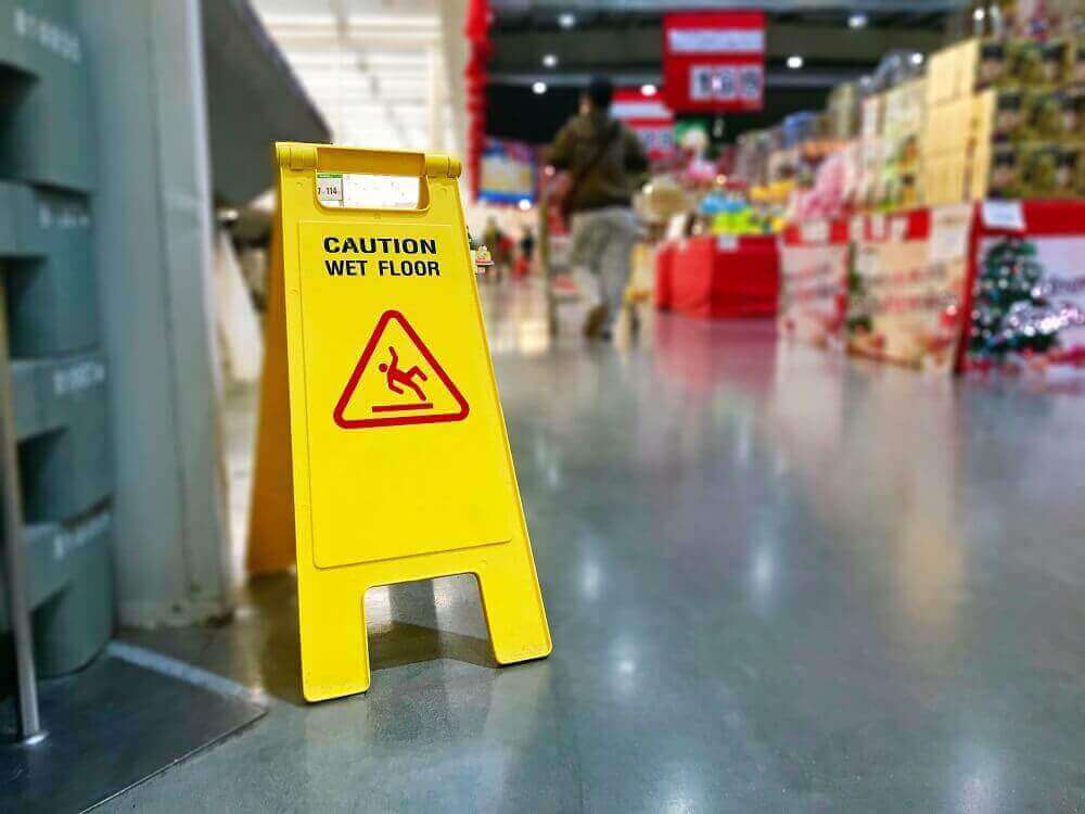Caution sign for slip and fall inside the grocery store.